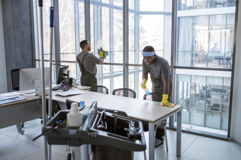 full shot men cleaning office